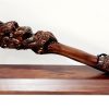 Large Carved Maori Hei Matau (Fish Hook) from Kauri Wood with Paua Shell Eyes on Stand 21st Keys 